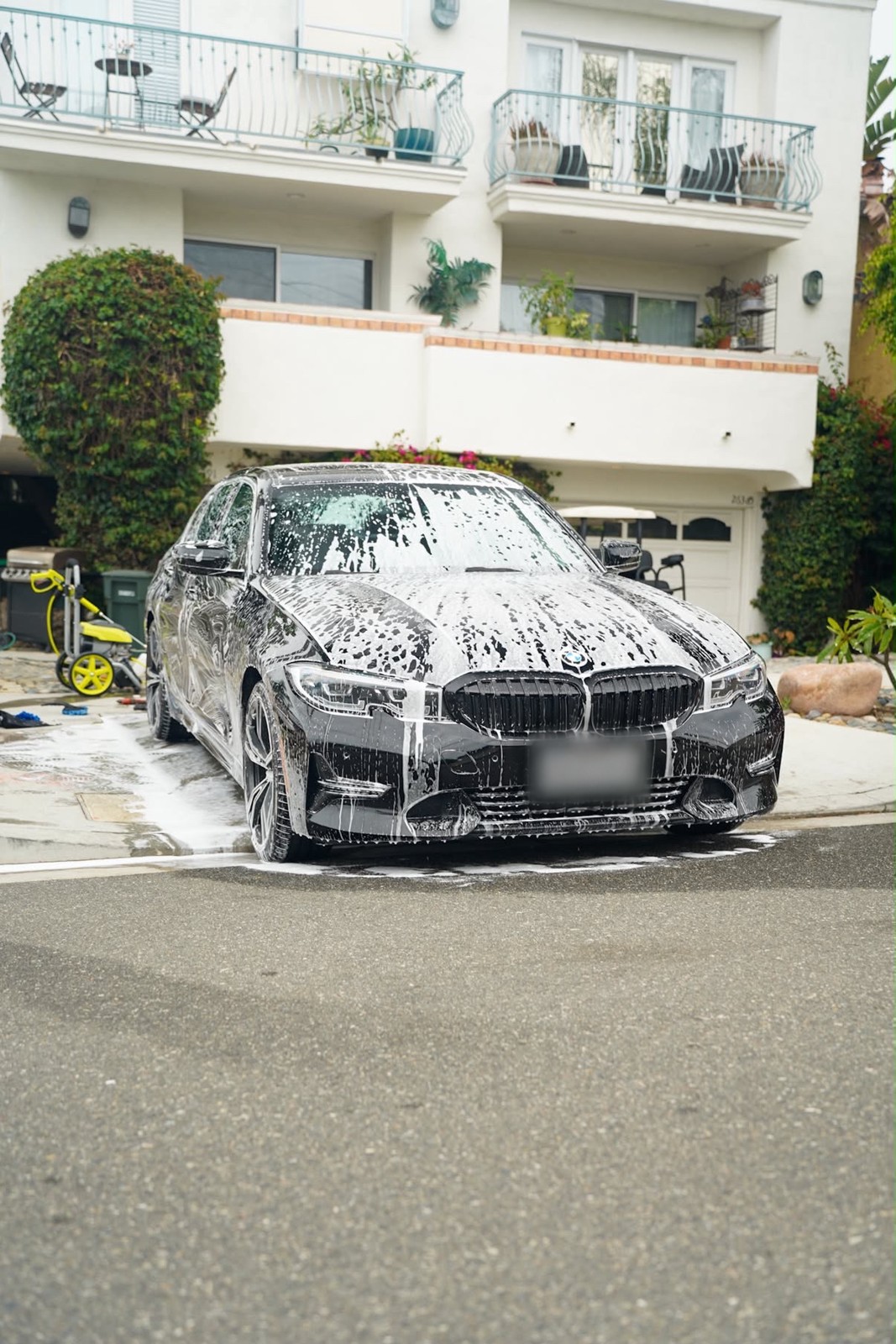 BMW receiving a foam wash, front view